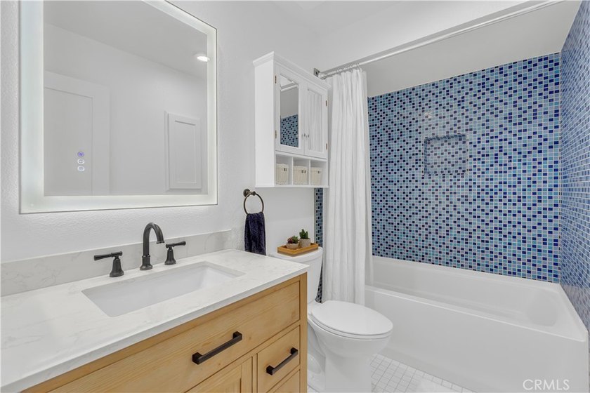 This 3-bedroom, 2-bath upstairs condo is beautifully updated - photo 33