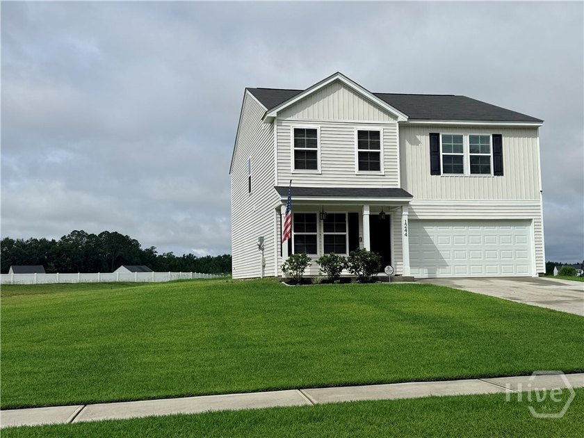 Positioned on a pond-view lot, this move-in ready 2023-built - photo 3