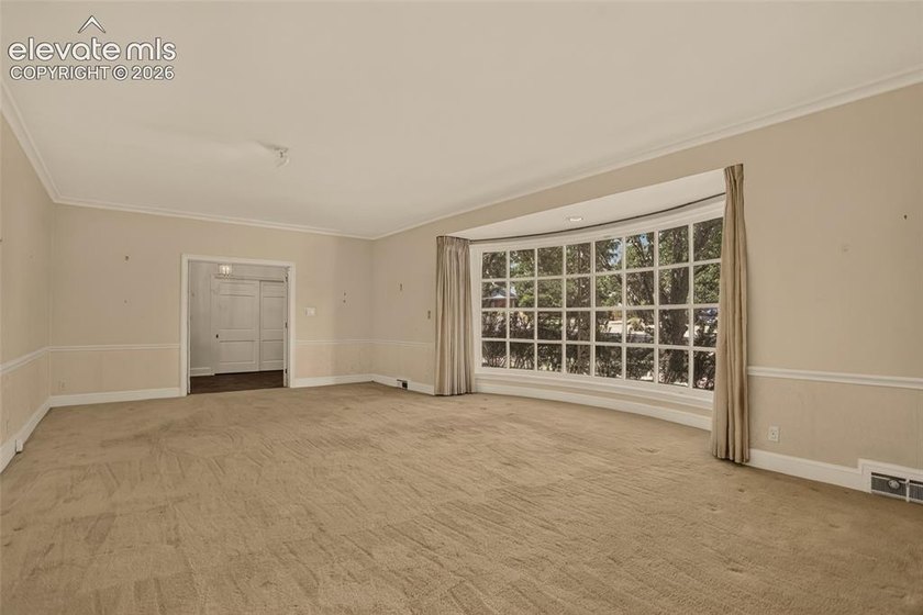 Lovingly preserved and timeless 1954 brick Colonial ranch on a - photo 9