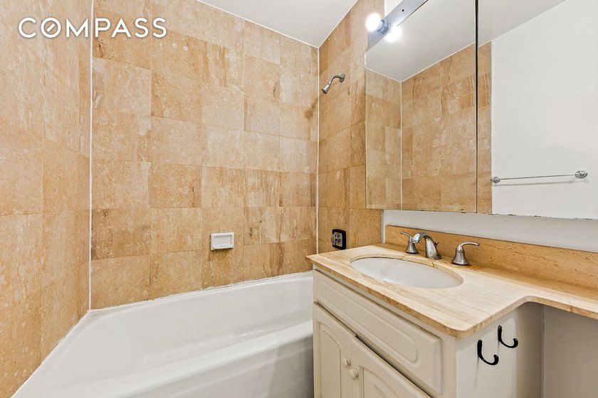Residence 14B at the Cosmopolitan Condominium is a bright and - photo 8