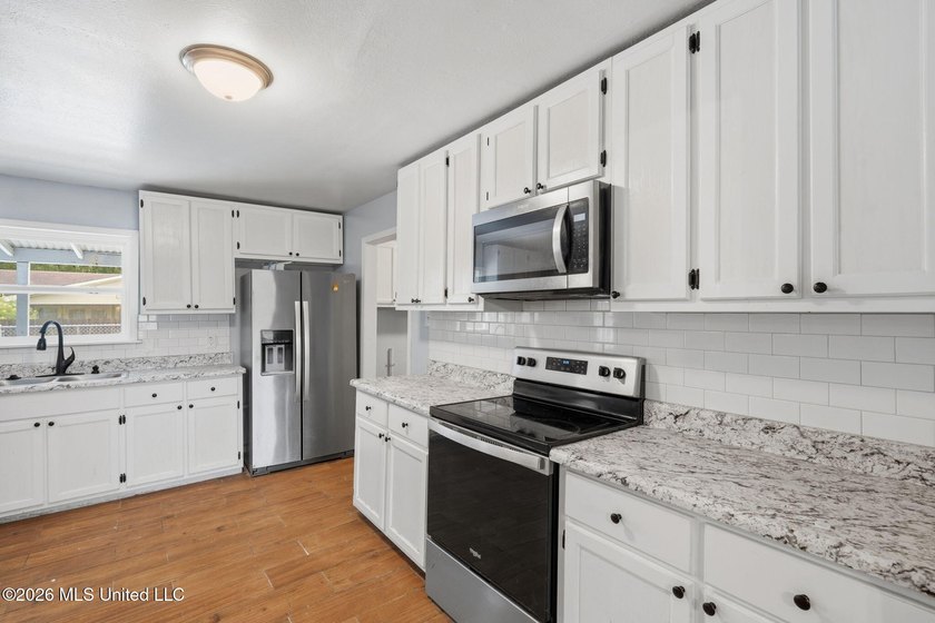 This 3-bedroom, 3-bathroom residence offers the perfect blend of - photo 11