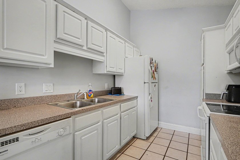 Welcome to 1141 Peace Pipe Place (Unit 201) in the gated - photo 14