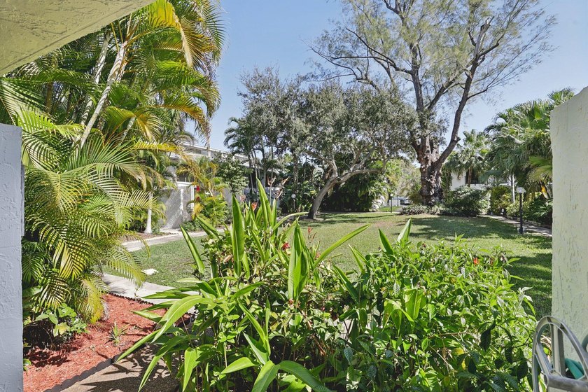 Discover a rare corner-unit retreat in a secure, gated community - photo 2