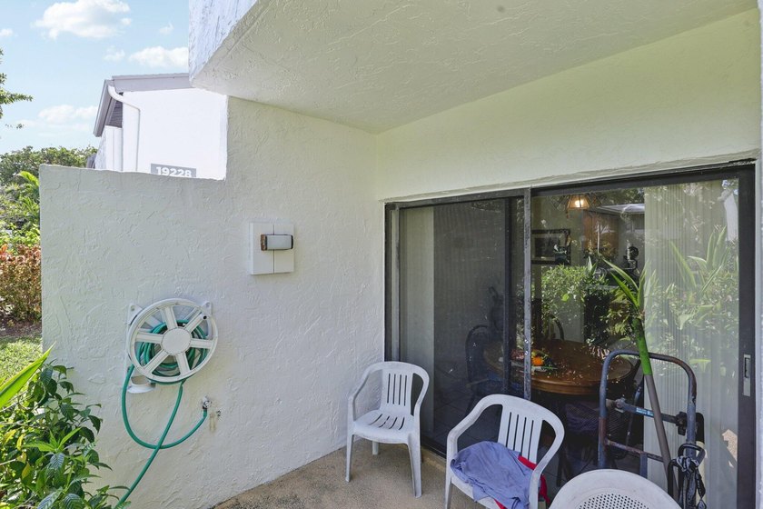 Discover a rare corner-unit retreat in a secure, gated community - photo 3