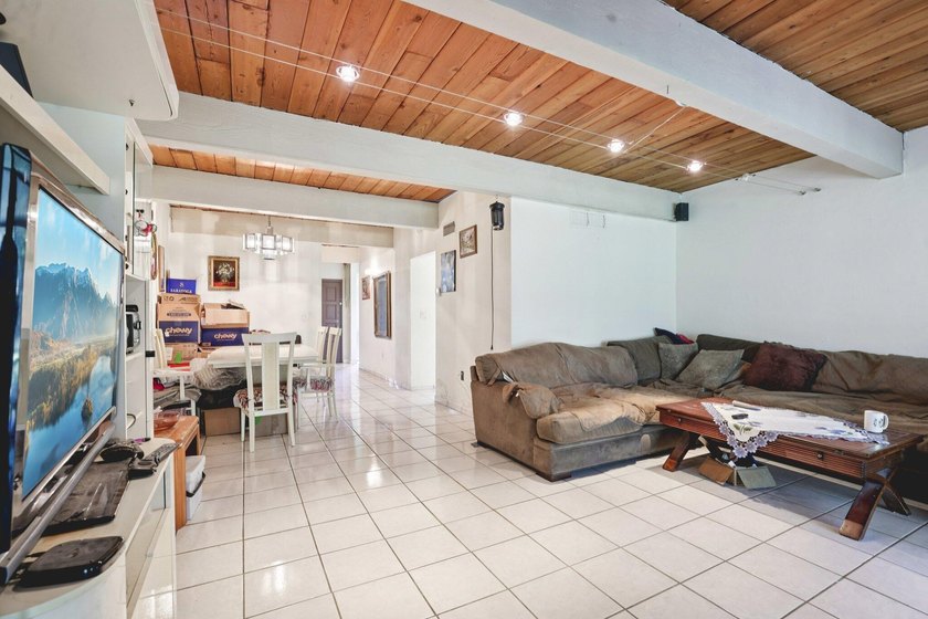 Discover a rare corner-unit retreat in a secure, gated community - photo 5