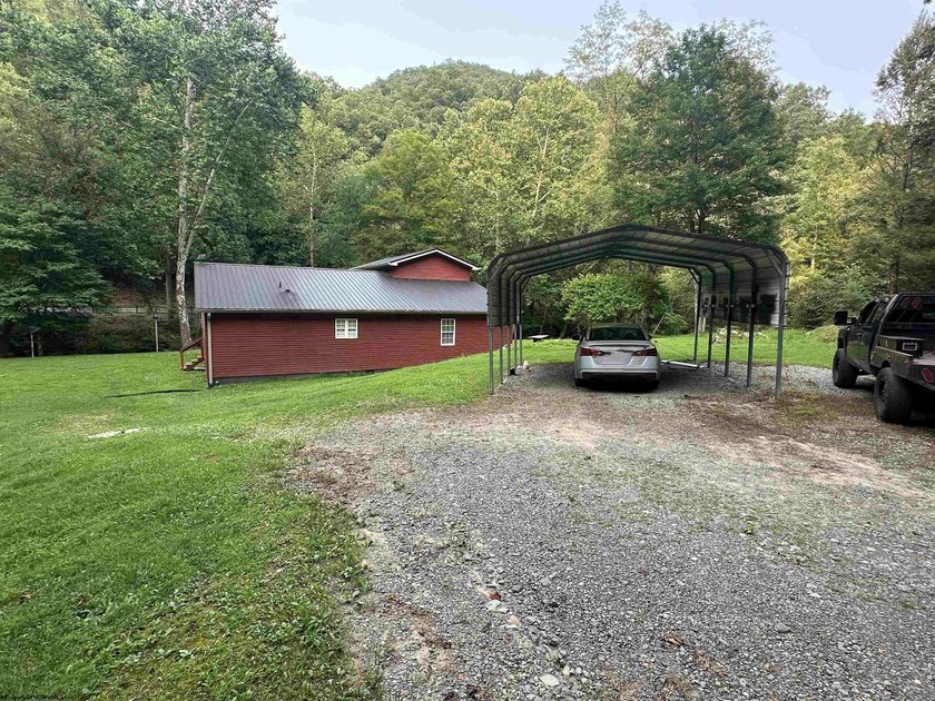 Riverfront retreat on 8 breathtaking acres! This beautiful home - photo 30