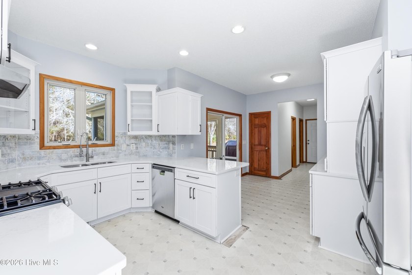Interior pictures are here! Nestled on a partially wooded 1.67 - photo 8