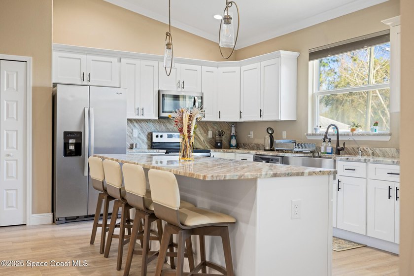 Welcome to this meticulously updated 4-bed, 3-full bath home - photo 8
