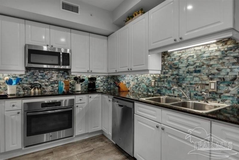 This 3br/3ba 1st floor condo has a second level view. It's - photo 11