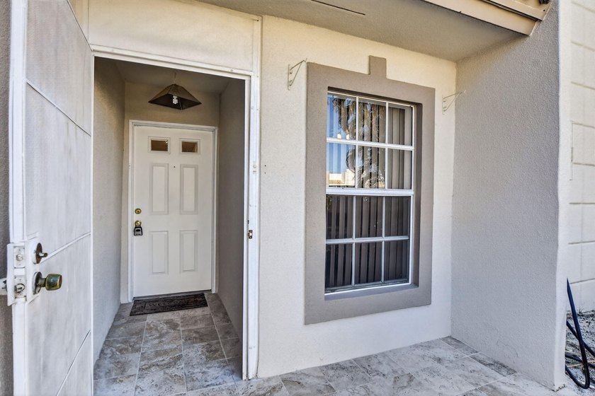 Fully updated 2/2 with 1-car garage! Features an open kitchen - photo 4