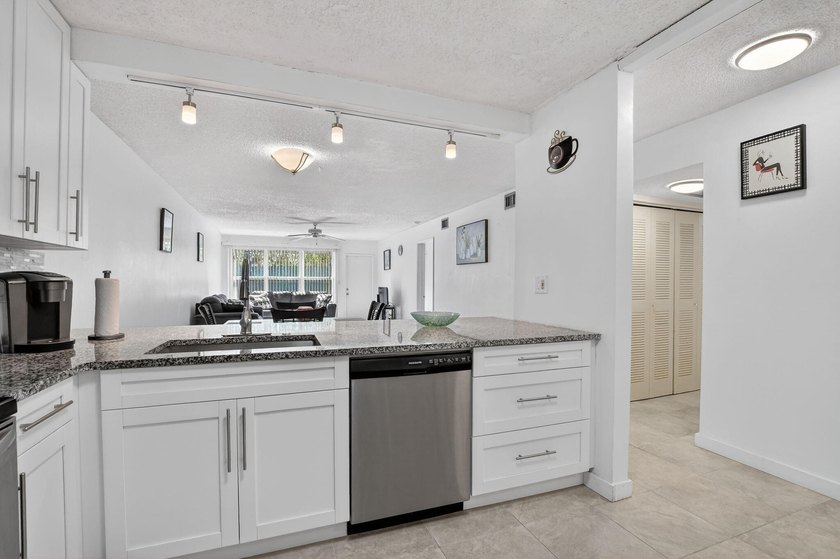 Fully updated 2/2 with 1-car garage! Features an open kitchen - photo 8