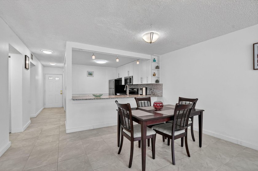 Fully updated 2/2 with 1-car garage! Features an open kitchen - photo 9