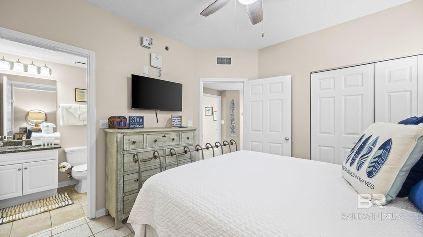 Step into coastal luxury with this beautifully updated, fully - photo 11
