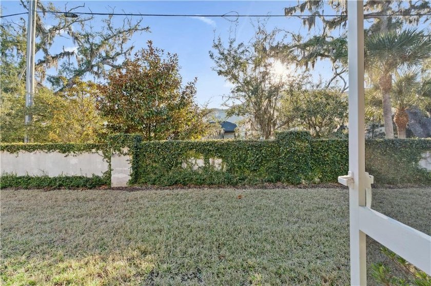 End unit with a large backyard and screened porch in Mariners - photo 8