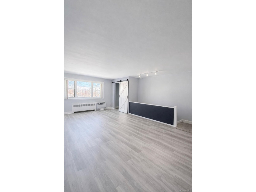 Welcome home to this sun-filled second-floor corner unit in a - photo 3