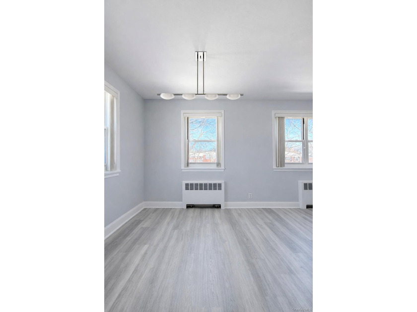 Welcome home to this sun-filled second-floor corner unit in a - photo 7