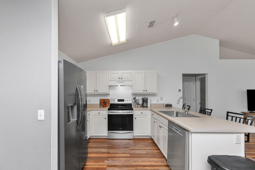 This charming brick home delivers a warm, functional layout - photo 11