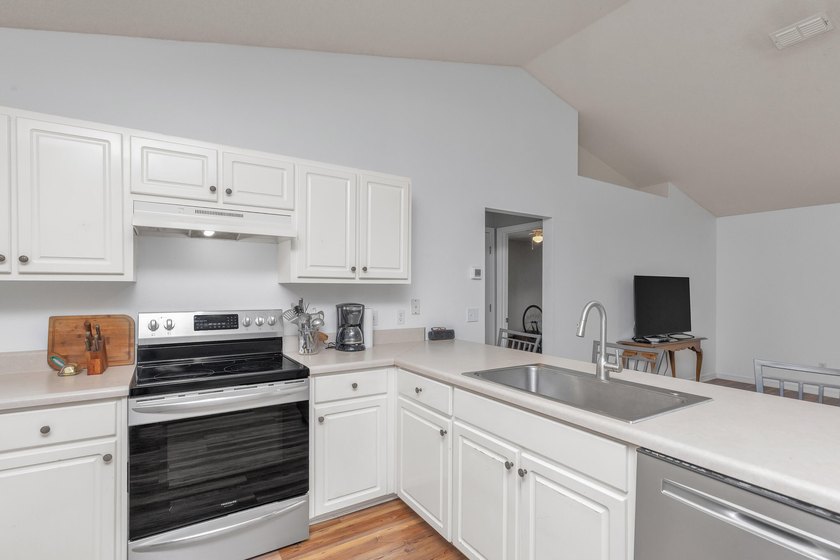 This charming brick home delivers a warm, functional layout - photo 14