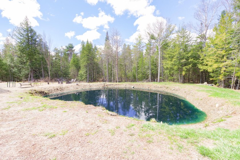 Set on nearly 2 private acres in Freedom, Maine, this unique - photo 7