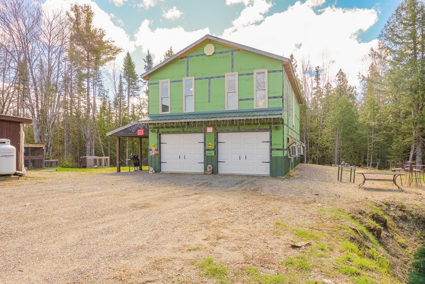 Set on nearly 2 private acres in Freedom, Maine, this unique - photo 9
