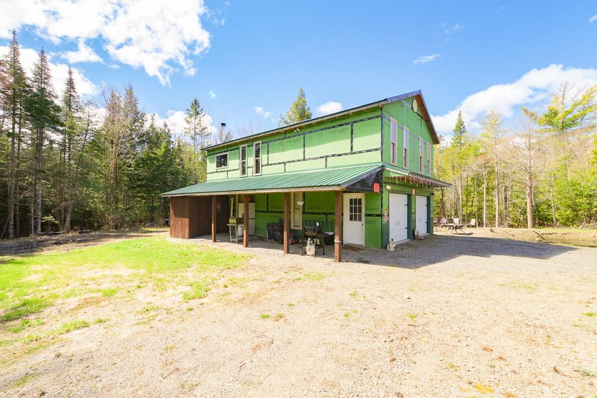 Set on nearly 2 private acres in Freedom, Maine, this unique - photo 10