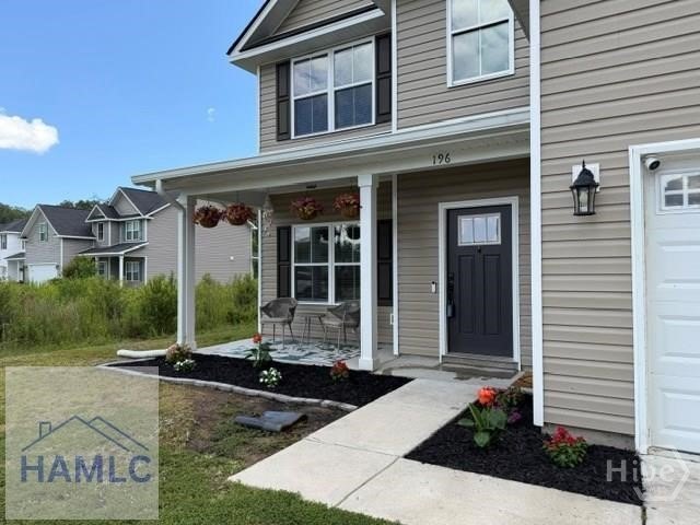 Spacious 4-bedroom 2.5 bath home features grand foyer with - photo 3