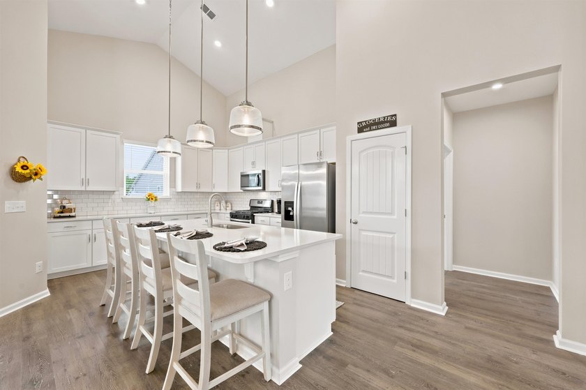 Don't wait too long to see this GEM! Built in 2021, this - photo 15