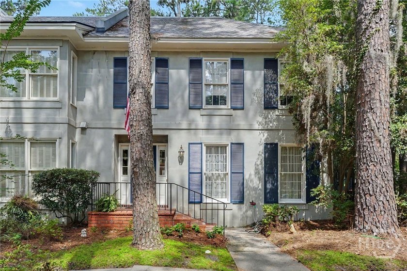 Tucked into a walkable enclave of town, this two-story townhome - photo 3