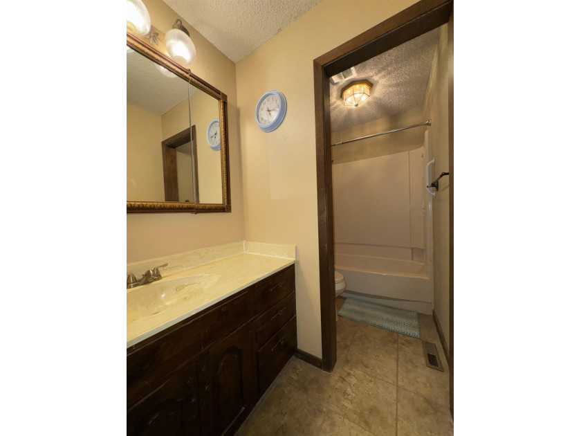 Welcome to 909 Crescent Drive in Ness City, where space, comfort - photo 34