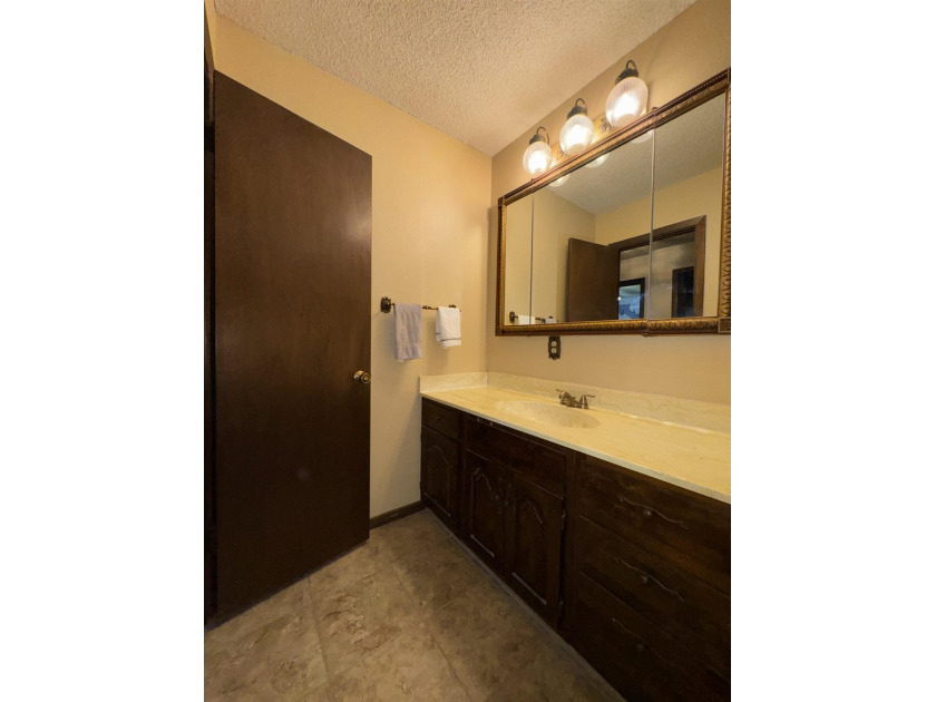 Welcome to 909 Crescent Drive in Ness City, where space, comfort - photo 37