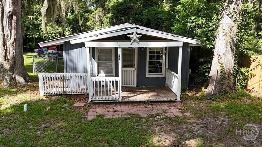Welcome to this two bedroom, one bath home nestled on a generous - photo 3
