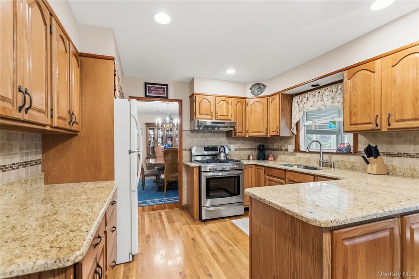 Nestled on a quiet cul-de-sac in one of East Setauket's most - photo 18