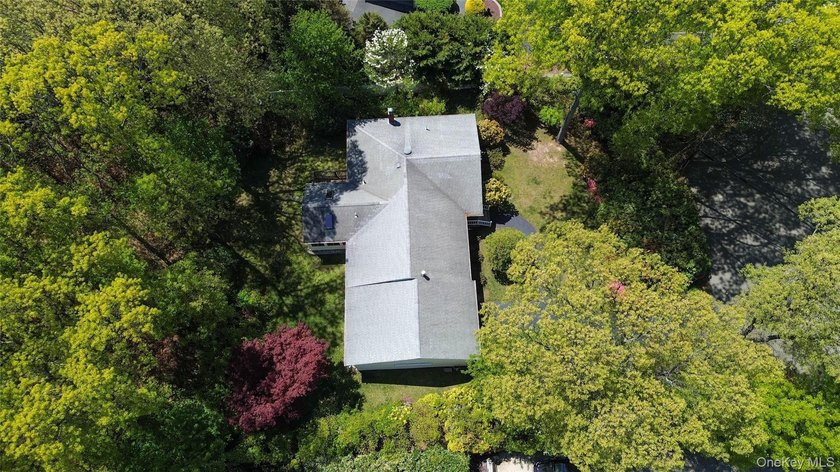 Nestled on a quiet cul-de-sac in one of East Setauket's most - photo 38