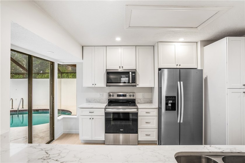Sophistication meets the shoreline in this renovated modern pool - photo 13