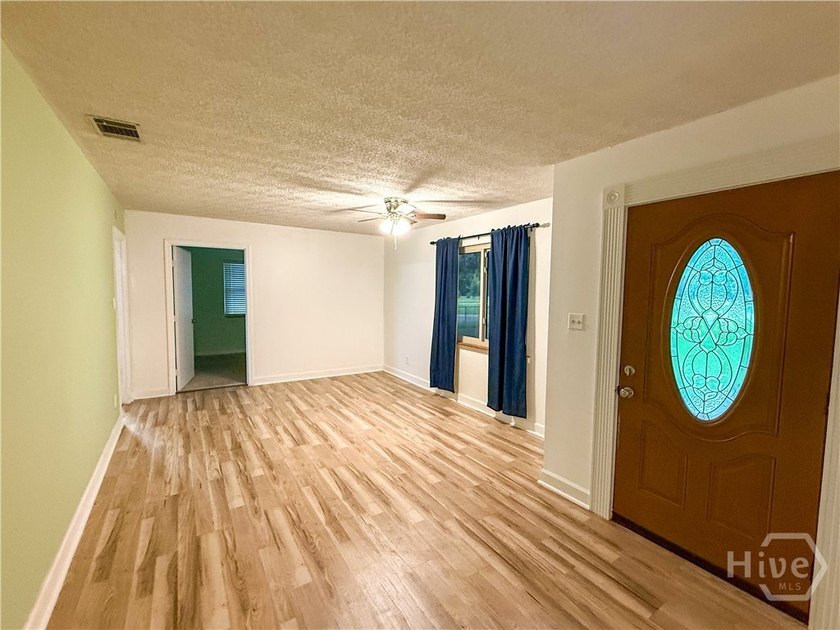 Well-built and well-maintained, this 4-bedroom, 2-bath lakefront - photo 4