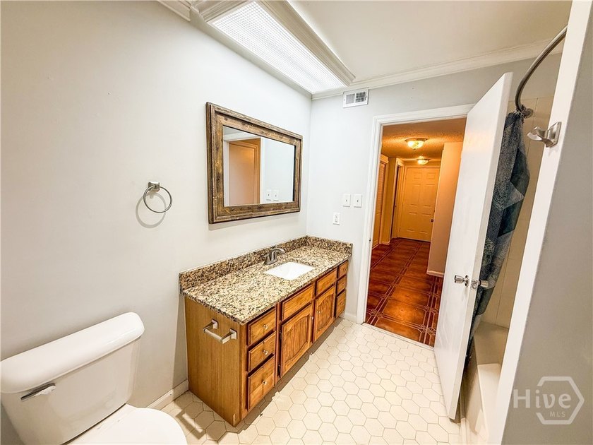 Well-built and well-maintained, this 4-bedroom, 2-bath lakefront - photo 9