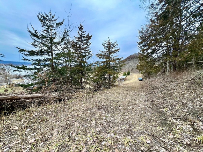 Private and wooded 7.1 acres on the outskirts of the charming - photo 20