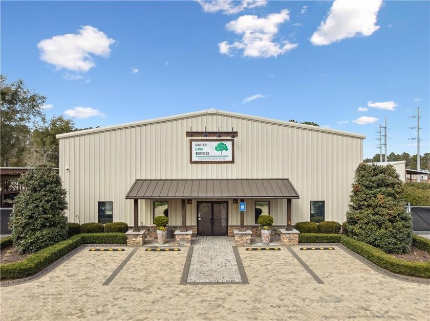 Situated on +/- 2.82 acres, this impressive commercial property - photo 2