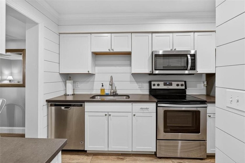 This adorable furnished condo has been remodeled and is in - photo 8