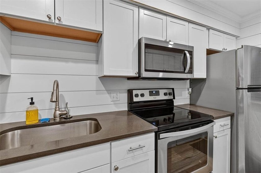 This adorable furnished condo has been remodeled and is in - photo 9