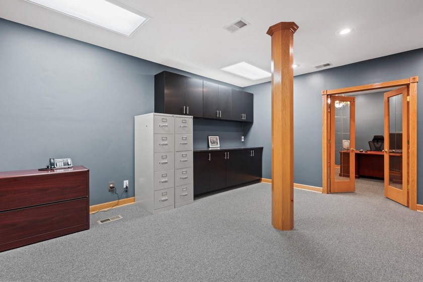 The main level offers 1,365 square feet, providing four offices - photo 6