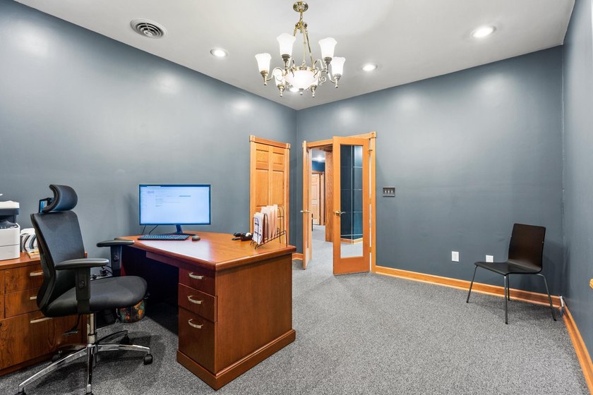 The main level offers 1,365 square feet, providing four offices - photo 9