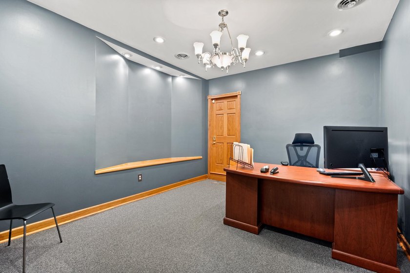 The main level offers 1,365 square feet, providing four offices - photo 10