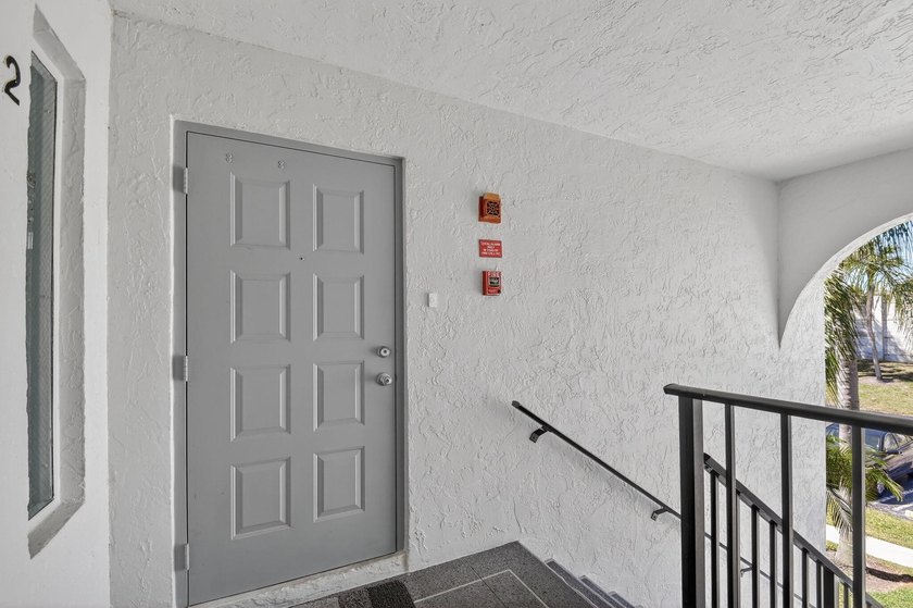 This corner unit, located on the 2nd floor, boasts impact glass - photo 6