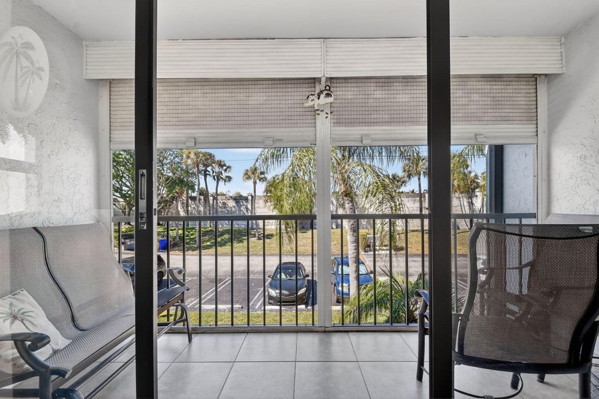 This corner unit, located on the 2nd floor, boasts impact glass - photo 7