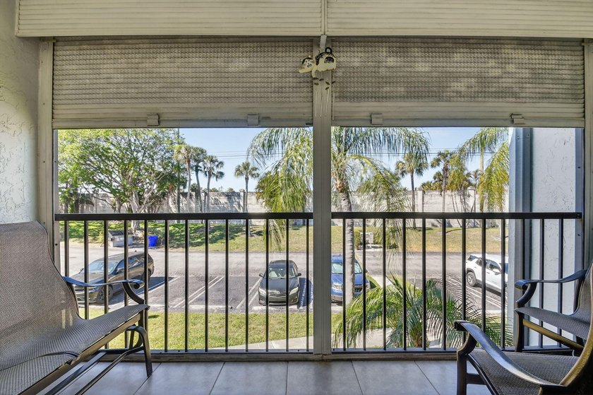 This corner unit, located on the 2nd floor, boasts impact glass - photo 8