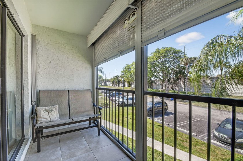 This corner unit, located on the 2nd floor, boasts impact glass - photo 9