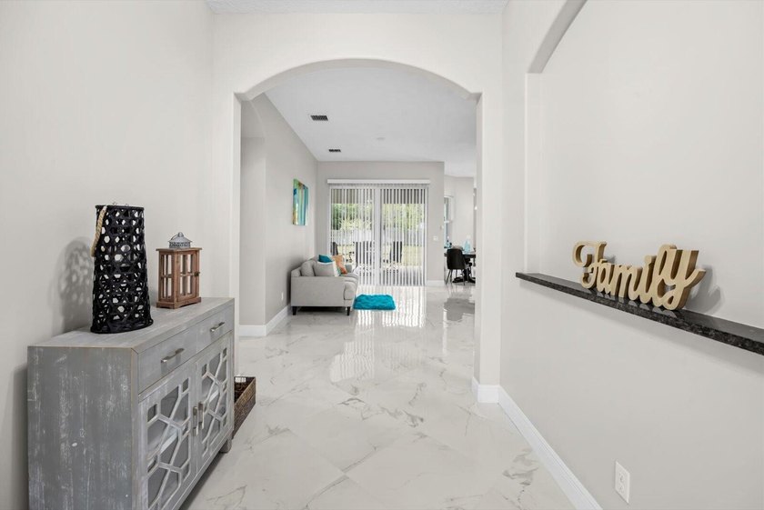 Welcome to this thoughtfully designed single-story residence in - photo 2