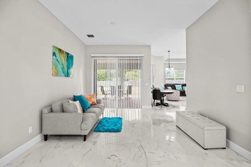 Welcome to this thoughtfully designed single-story residence in - photo 3