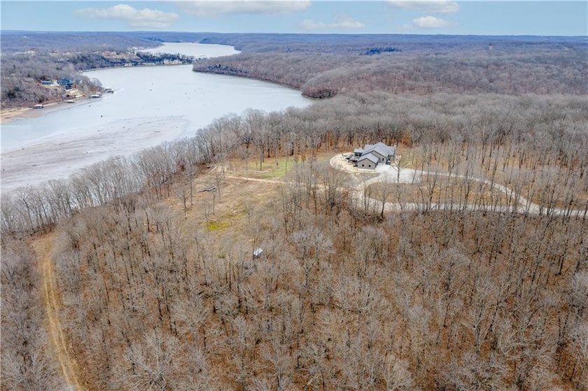 Indulge in waterfront living on approximately 5 serene acres at - photo 12